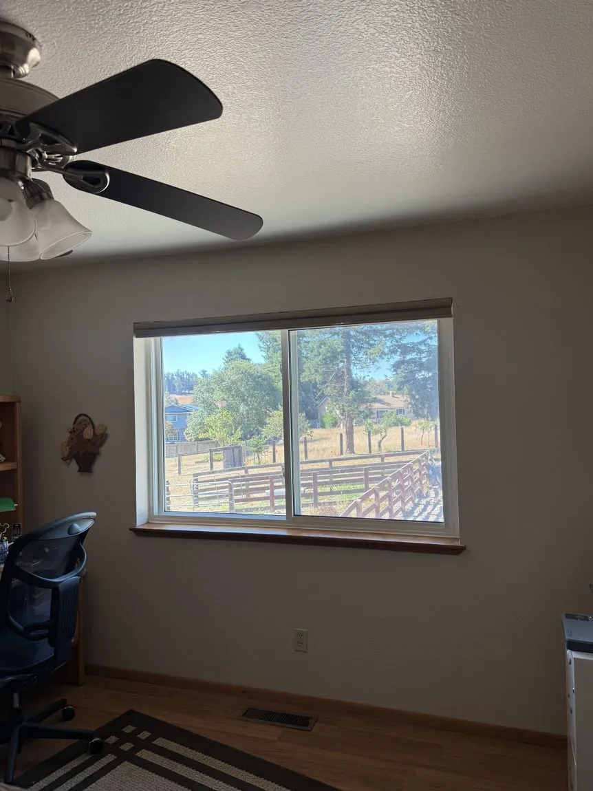 The same home office after solar film: glare controlled, view unchanged