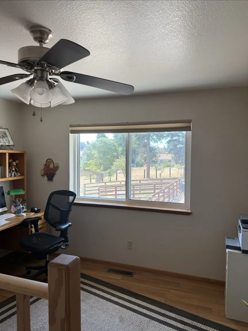 Home office before window film: bright glare on the window wall